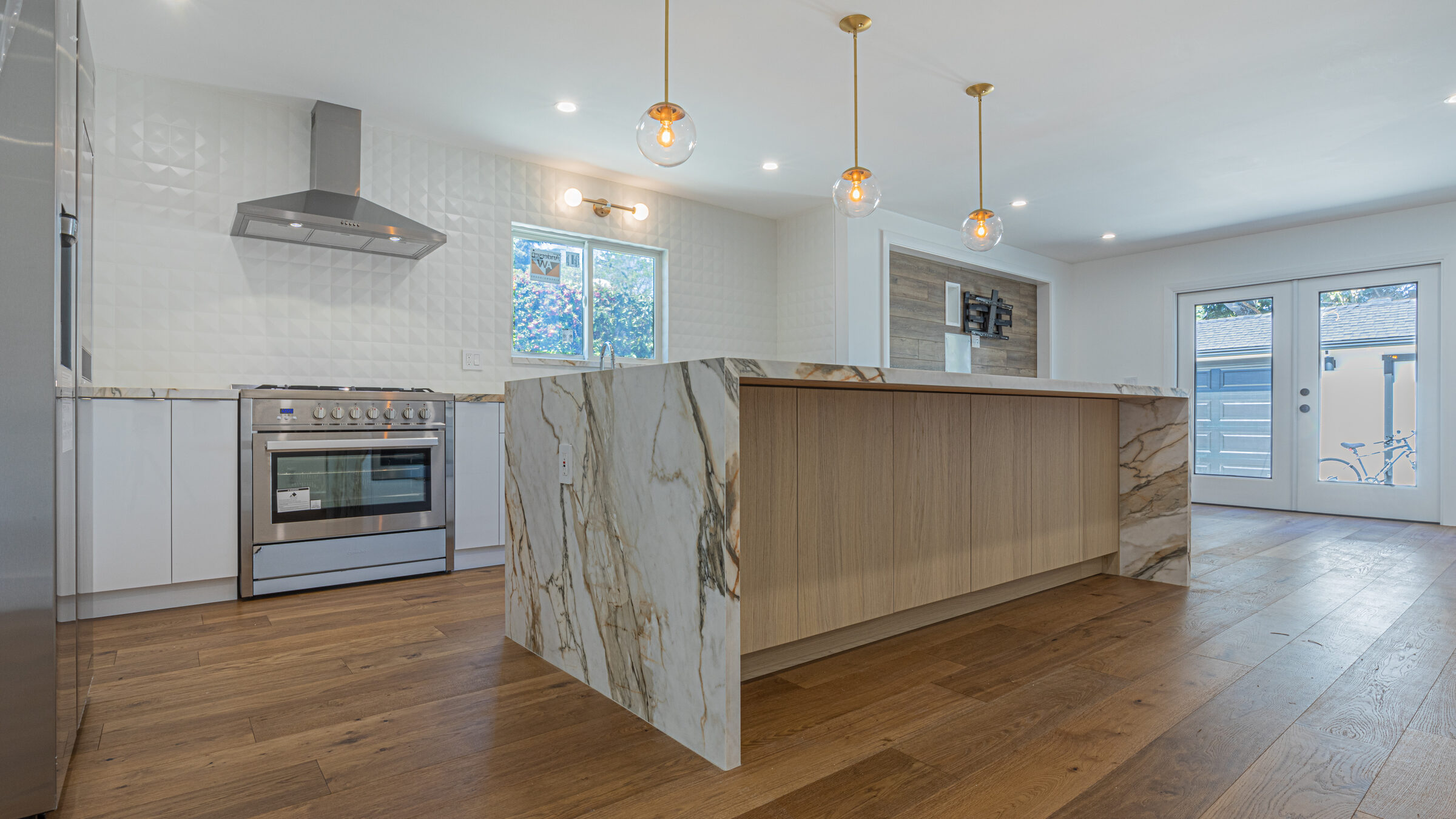 Pacific Heights kitchen remodel with book-matched stone island by We Do Construction